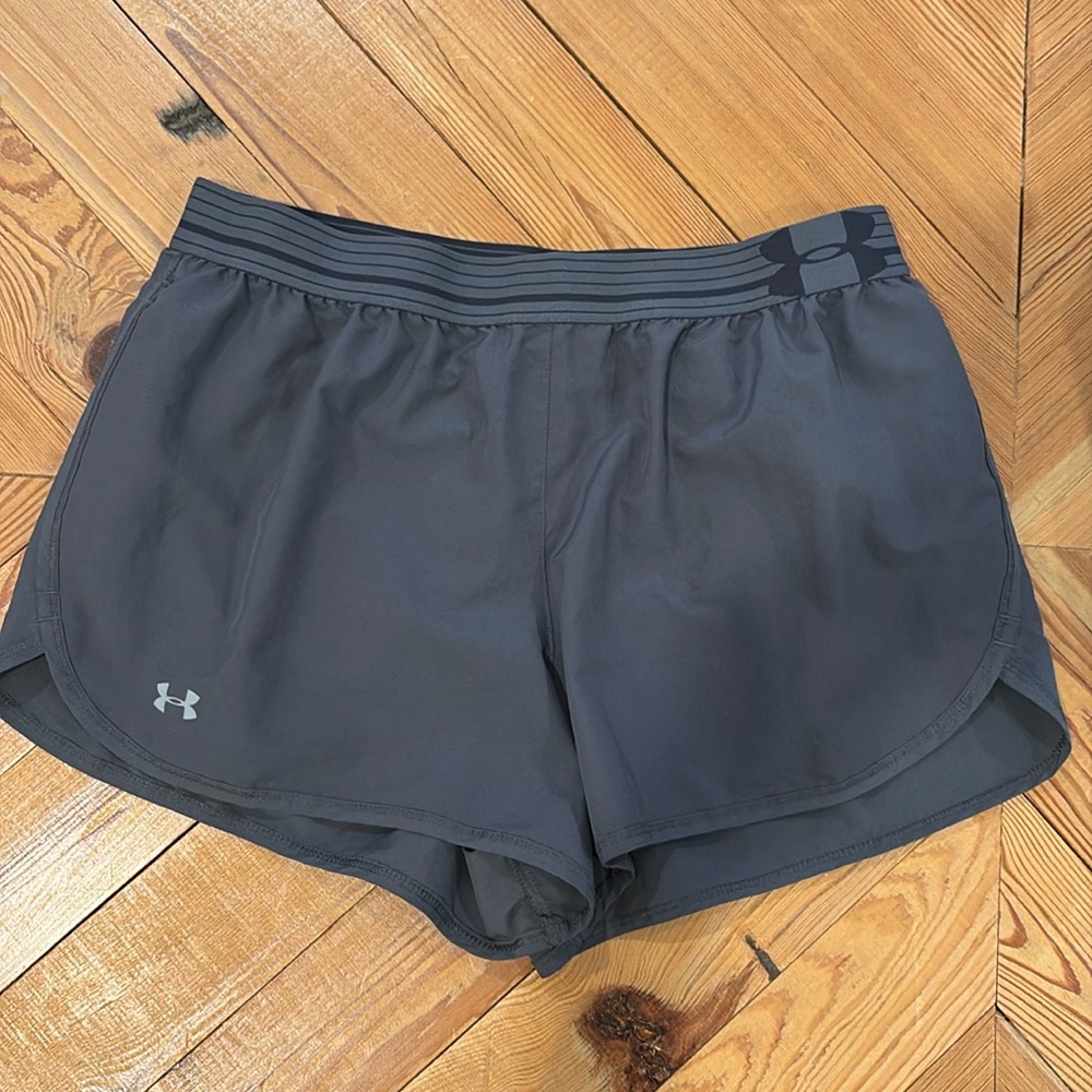 Women’s Under Armour heat gear shorts in medium.
